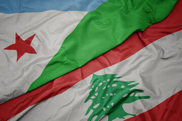 waving colorful flag of lebanon and national flag of djibouti.