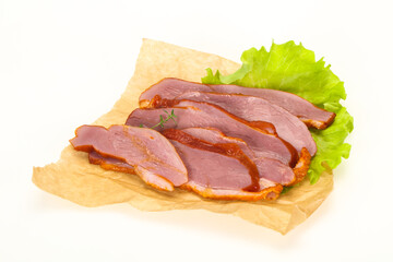 Sliced smoked duck breast served salad