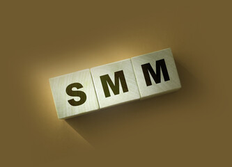 SMM abbreviation on wood cubes. Social media marketing. Business concept