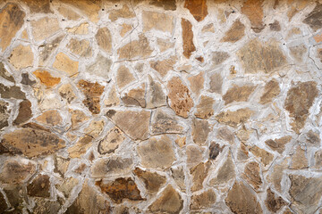 Natural stone masonry wall texture or background