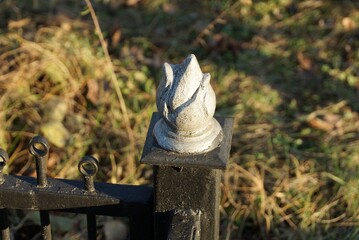  black iron decorative fence with a sharp one detail with a tip of gray metal