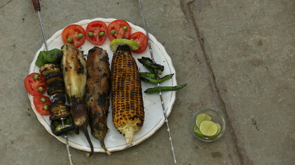 Indian BBQ roosted corn, paper, and chili