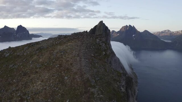 Incredible peak of Segla mountain diving into a beautiful Norwegian fjord Segla, lofoten island, Norway