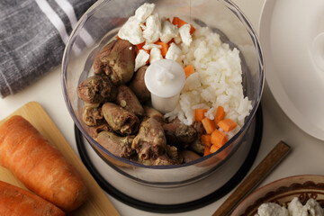 Chicken hearts, carrots, rice -ingredients for natural food for cats or dog