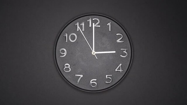 The Time Is 3.00 AM Or PM On A Black Wall Clock With A White Steel Second Hand.