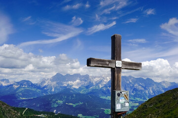 summit cross in a wonderful mountain landscape with blue sky