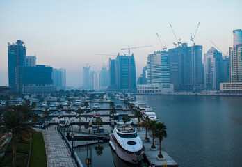 Fototapeta na wymiar Dubai, UAE - 01.15.2021 Sunrise over a Dubai water canal. Outdoors