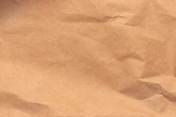 Texture of crumpled light brown craft paper.