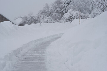 Snow storm in Bayern. View of cleaned road after a snow cyclone