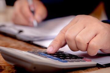 close up of hand holding a calculator