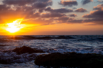 Cloudy Sunset Over Rocks