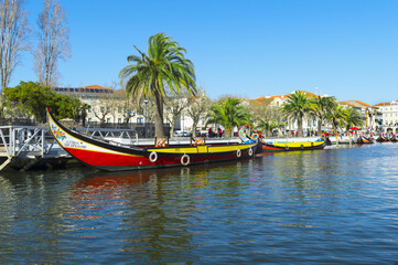 Fototapeta na wymiar Moliceiros moored along the main canal. Aveiro, Venice of Portugal, Beira Littoral, Portugal