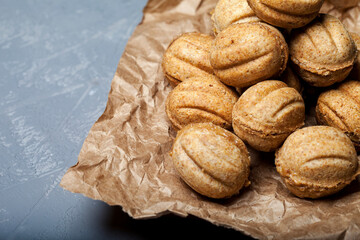 
Cookies with condensed milk in paper. Pastry biscuit nuts. Christmas cookies. New Year's composition.