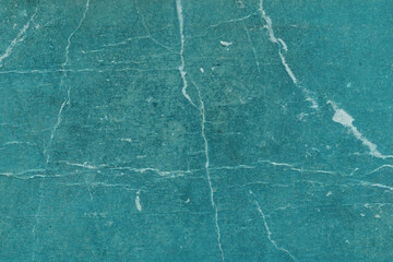 Cardboard blue abstract pattern texture close-up. Retro old paper background. Grunge concrete wall. Vintage blank wallpaper.