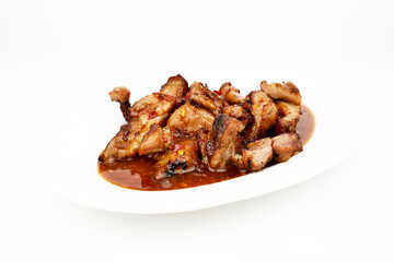 Assorted delicious Grilled pork and spicy sauce on a white plate isolated on white background