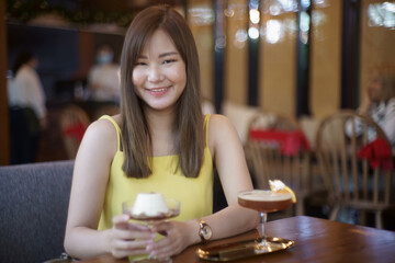 Asian girl have a breakfast in coffee shop