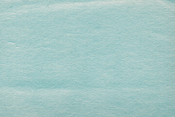 Cardboard blue abstract pattern texture close-up. Retro old paper background. Grunge concrete wall. Vintage blank wallpaper.