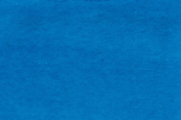 Cardboard blue abstract pattern texture close-up. Retro old paper background. Grunge concrete wall. Vintage blank wallpaper.