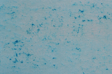 Cardboard blue abstract pattern texture close-up. Retro old paper background. Grunge concrete wall. Vintage blank wallpaper.