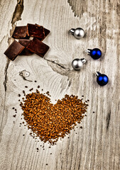 Fototapeta na wymiar coffee beans in a heart and chocolate bars