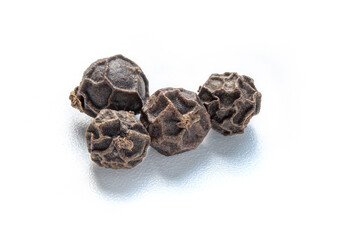close up macro shot Black peppercorns (Black pepper) isolated on white background.
