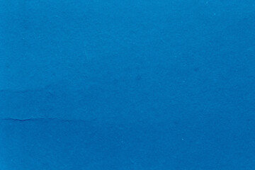 Cardboard blue abstract pattern texture close-up. Retro old paper background. Grunge concrete wall. Vintage blank wallpaper.