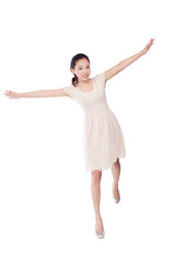 A Young woman standing with arms stretched