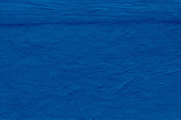 Cardboard blue abstract pattern texture close-up. Retro old paper background. Grunge concrete wall. Vintage blank wallpaper.