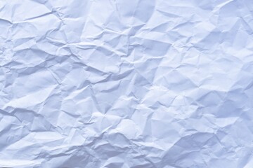 Obraz premium White crumpled paper textured background.
