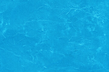 Cardboard blue abstract pattern texture close-up. Retro old paper background. Grunge concrete wall. Vintage blank wallpaper.