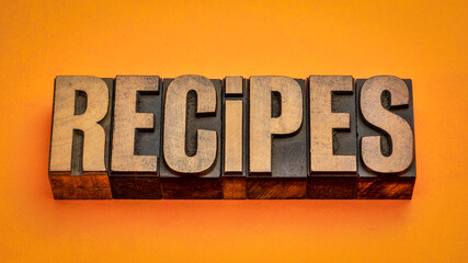 recipes banner - word in vintage letterpress wood type blocks against handmade paper, method,...