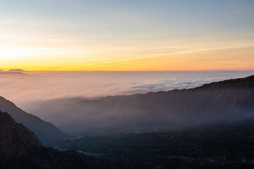 Fototapeta na wymiar Beautiful sunrise over sea of fog at Mount Bromo in Bromo Tengger Semeru National Park, East Java, Indonesia