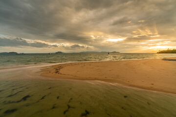 Fototapeta na wymiar White sand beach in Phayam Island at sunset, Ranong, Thailand.