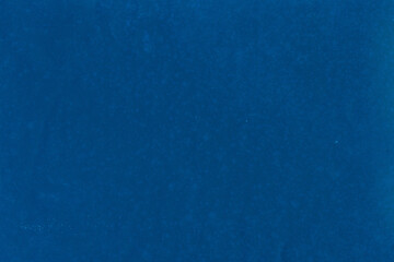 Cardboard blue abstract pattern texture close-up. Retro old paper background. Grunge concrete wall. Vintage blank wallpaper.