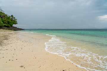 White sand beach in khang khao island, Ranong, Thailand in cloudy day.
