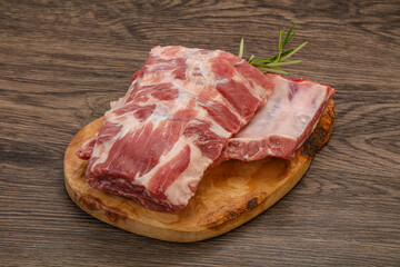 Raw pork ribs served rosemary