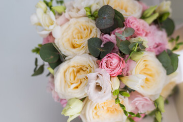 beautiful bouquet on a gray background. Soft pink roses and cream, yellow