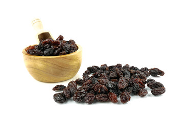 Black sweet Raisins or dried sweet grapes (kali kishmish or Zante currant) isolated on white...