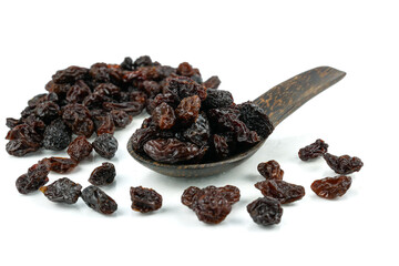 Black sweet Raisins or dried sweet grapes (kali kishmish or Zante currant) isolated on white background