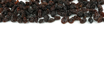 Black sweet Raisins or dried sweet grapes (kali kishmish or Zante currant) isolated on white background