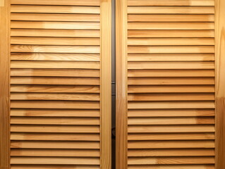 Cabinet doors made of stacked wooden boards close-up. Background