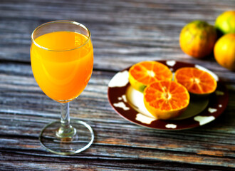orange juice is in the glass.It is sour and rich in vitamin c.