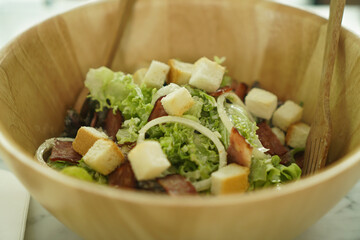 Bowl of Traditional Caesar Salad with Chicken and Bacon