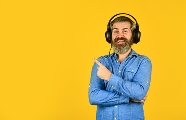 Hipster enjoy excellent sound song in earphones. Music beat. Noise cancelling function. Dj hipster....