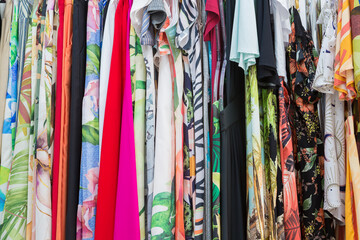 Dresses of various prints and colors for sale in a store