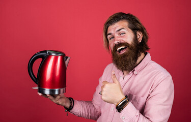 Bachelor smile. man going to drink tea or coffee. brutal man with moustache and beard. electric...