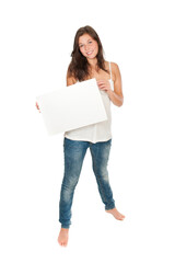 Full length portrait of a gorgeous smiling woman holding an empty billboard, isolated on white studio background