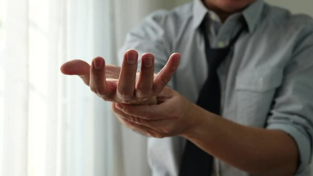 Asian men have numbness on their wrists and fingertips due to peripheral neuropathy.