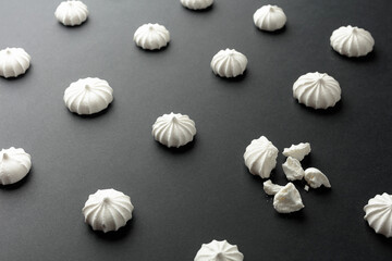 Small white meringues on the table.