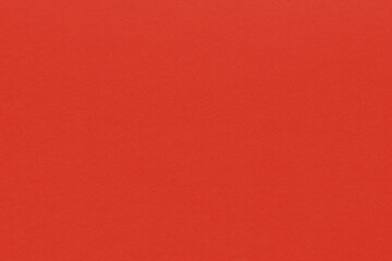 Clean red retro paper background. Vintage cardboard texture. Grunge paper for drawing. Simple blank fabric pattern.